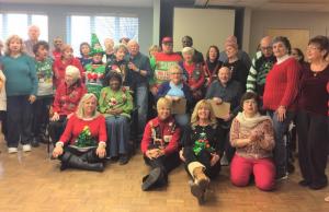 crowd displays crazy sweaters