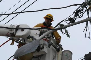 Electric Lineman Restoring Power