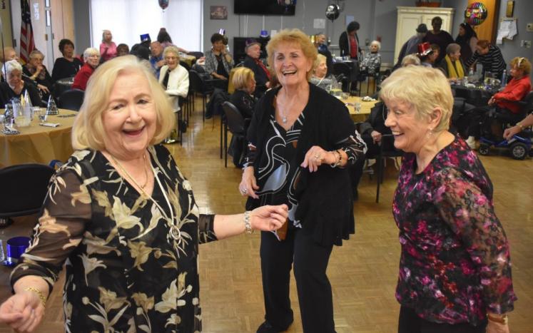 Helen Gemnell, left, Marge DePhillips and Pat Turner danced the afternoon away at the Sandel Senior Center’s New Year’s party